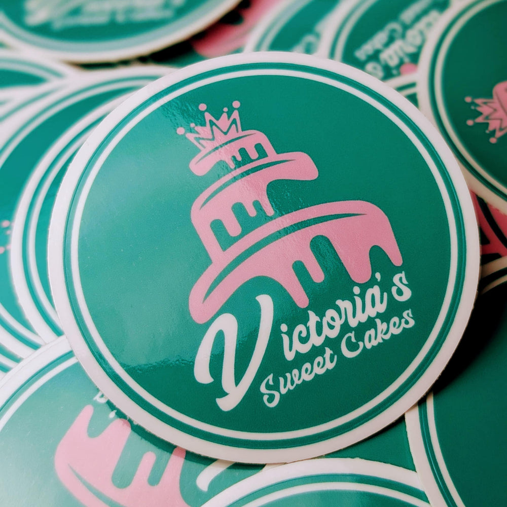 Stickers with 'Victoria's Sweet Cakes' logo on a green background